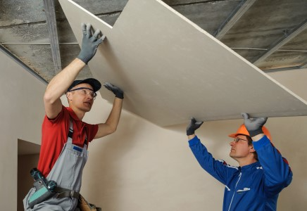 two drywall technicians